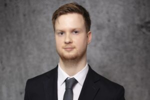 Professional headshot of Thomas Whittock.