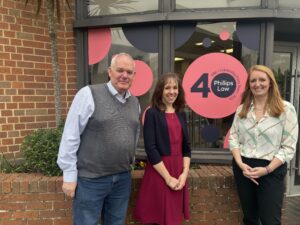 Steven Vallery, Elizabeth Taylor, Sian Lias in front of the Phillips Law office in Basingstoke
